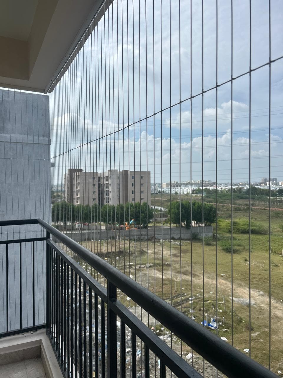 Frameless invisible balcony grills for child safety - Professional installation by Falcon Grills Mumbai